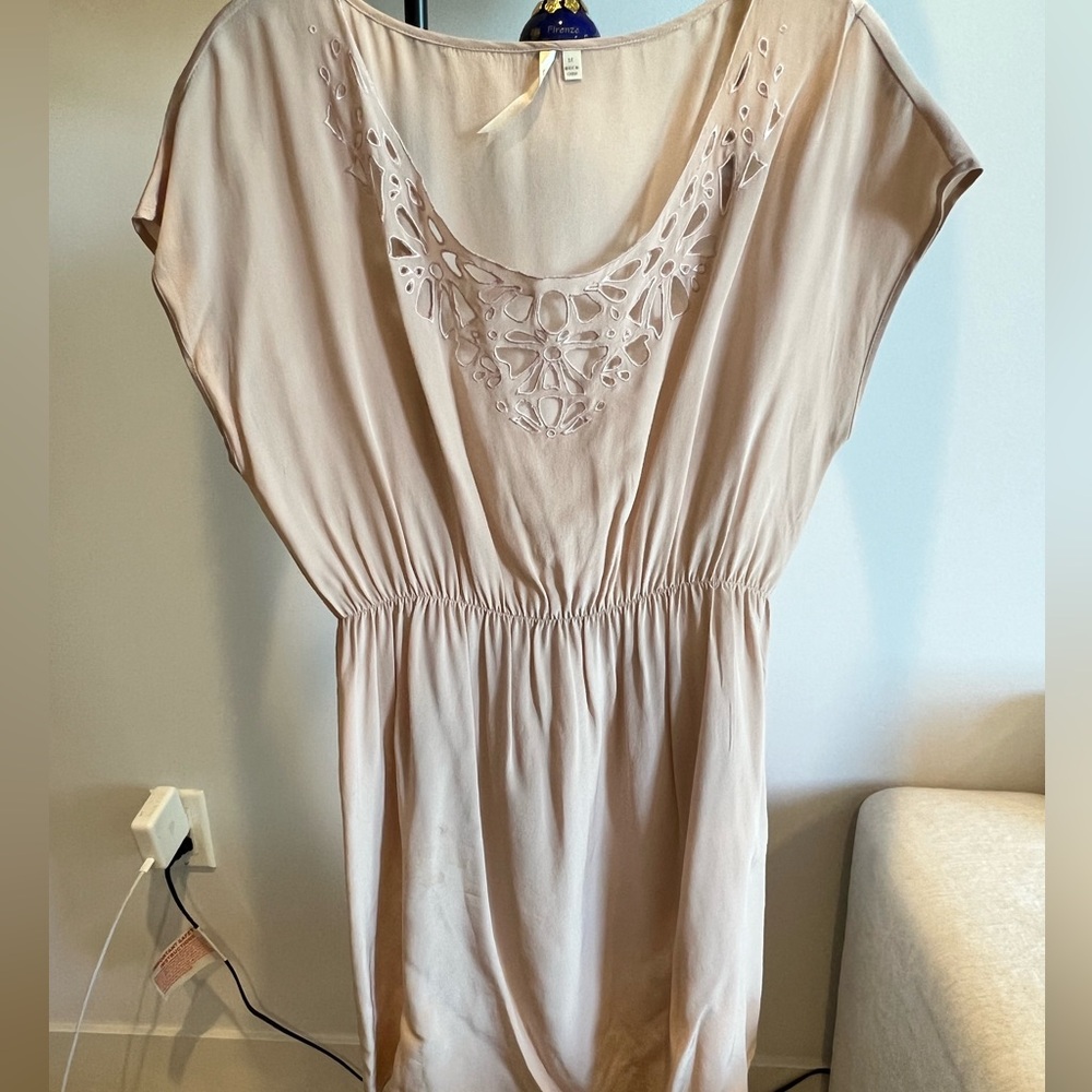 Silky pink top/dress with cutout design.